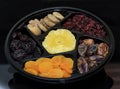 Group of dried fruit for Tu Bishvat holiday . Apricot, fig, palm, and plum, blueberry and pineapple