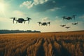 group of drones flies low over a field