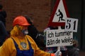 Group of Dutch citizens celebrating the Rogstaekers parade with a display of colorful costumes