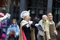 Group of Dutch citizens celebrating the Rogstaekers parade with a display of colorful costumes