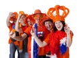 Group of Dutch soccer fans making polonaise over white background Royalty Free Stock Photo