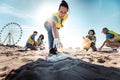 Group of eco volunteers picking up plastic trash on the beach - Activist people collecting garbage protecting the planet Royalty Free Stock Photo