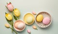 a group of eggs and flowers on a blue surface with a white basket and yellow tulips on the side of the egg carton