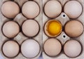 Group of eggs - one broken with yolk on the top. Royalty Free Stock Photo