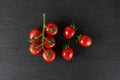 Red cherry tomato on grey stone Royalty Free Stock Photo