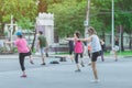 Group of elderly friend doing aerobic dance after work together