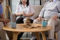 Group of elderly people enjoy talking , relaxing with game at  senior healthcare center Royalty Free Stock Photo