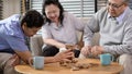 Group of elderly people enjoy talking , relaxing with game at  senior healthcare center Royalty Free Stock Photo