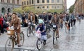 Group of elegant cycling people wearing old fashioned tweed clot