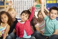 Group Of Elementary Age Schoolchildren Answering Question In Class Royalty Free Stock Photo