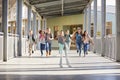 Group of elementary school kids running in a school corridor Royalty Free Stock Photo