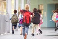 Group of elementary school kids running at school, back view Royalty Free Stock Photo