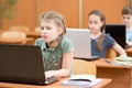 Group of elementary school kids working together in computer class Royalty Free Stock Photo