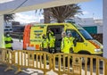 Group of emergency services workers in high vis jackets by ambulance at Teguise Sunday market in Lanzarote, Spain