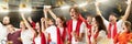 Group of emotive, expressive young people, football, soccer fans cheering team at the stadium. Winning emotions. Concept Royalty Free Stock Photo