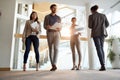 A group of employees at company`s hallway. People, job, company, business concept