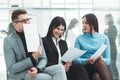 Group of employees discussing the terms of an employment contract