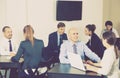 Group of employees with laptops in office Royalty Free Stock Photo