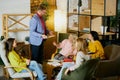 Group of employees, man and women, colleagues having meeting, projects discussion at the office, indoors. Creative Royalty Free Stock Photo