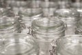 A group of empty cans with a lid. Rows of glass containers in a store. Close-up.