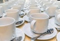 Group of empty coffee cups. Many rows of white cup for service tea or coffee in breakfast