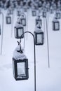 Group of empty lanterns in a cemetery in winter Royalty Free Stock Photo