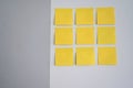 Group of empty sticky notes on a wall