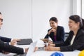 Group of engineer asian people meeting and working communicating while sitting at room office desk together,Teamwork Concept Royalty Free Stock Photo