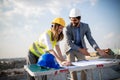 Group of engineers, architects, business partners at construction site working together Royalty Free Stock Photo