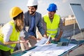 Group of engineers, architects, business partners at construction site working together Royalty Free Stock Photo