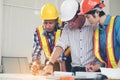 Group engineers and architects are discussing the construction.