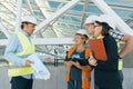 Group of engineers, builders, architects on the building site. Construction, development, teamwork and people concept Royalty Free Stock Photo