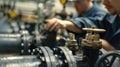 A group of engineers testing and calibrating large pipes and valves that will eventually connect to the main industrial