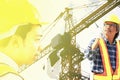Group of engineers using radio communication in big construction site with construct crane