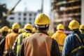 Group of engineers working in the construction site. Selective focus, rear view of Construction workers at the construction site