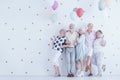 Group of enthusiastic elderly people with colorful balloons Royalty Free Stock Photo