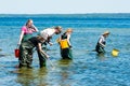 Group examining water with ring nets