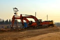 Group of the excavators in a quarry for the extraction of sand, gravel, rubble, quartz and other minerals