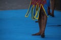 Group of excited African folk dancers, wearing traditional clothing, performing a vibrant dance Royalty Free Stock Photo