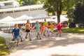 The group of excited preschoolers are running together Royalty Free Stock Photo