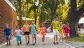 The group of excited preschoolers are running together Royalty Free Stock Photo