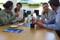 Group of executives discussing a project at desk