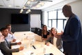 Group of executives sitting in conference room