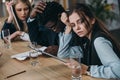 group of exhausted zombie like businesspeople sitting