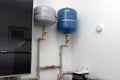 Group of expansion tanks in house boiler room Royalty Free Stock Photo