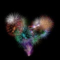 A group of exploding fireworks shaped like a heart. Royalty Free Stock Photo
