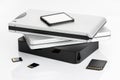 Group of external Hard disks and memory cards on white table
