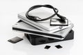 Group of external Hard disks and memory cards on white table