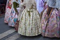 Group of falleras dressed in regional costume at the exit of the Ofrenda floral Offering to the Virgin Mary in Valencia, Spain