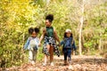 Group family children checking map for explore and find directions in the camping jungle nature Royalty Free Stock Photo